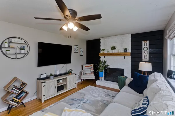a living room with furniture and a flat screen tv