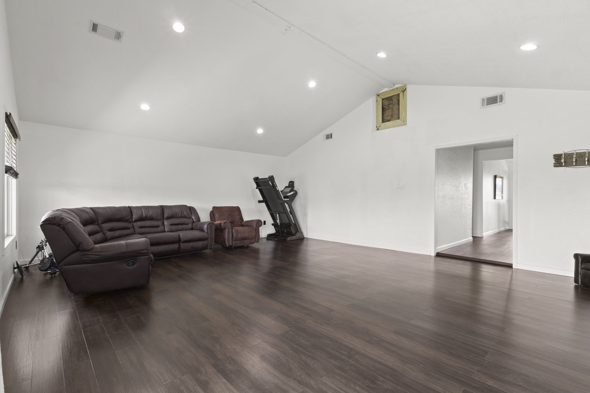 19961 Englin Road Winnie, TX 77665 - Photo 12 of 26 a living room with furniture and a wooden floor