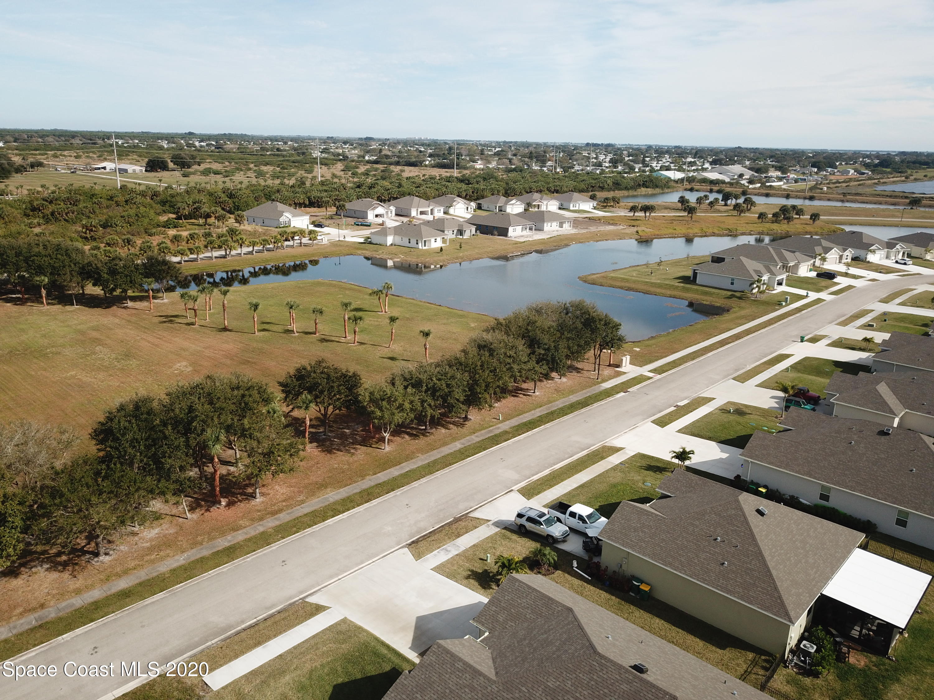 Tbd Micco Road Micco, FL 32976 - Photo 13 of 15 an aerial view of residential building and lake