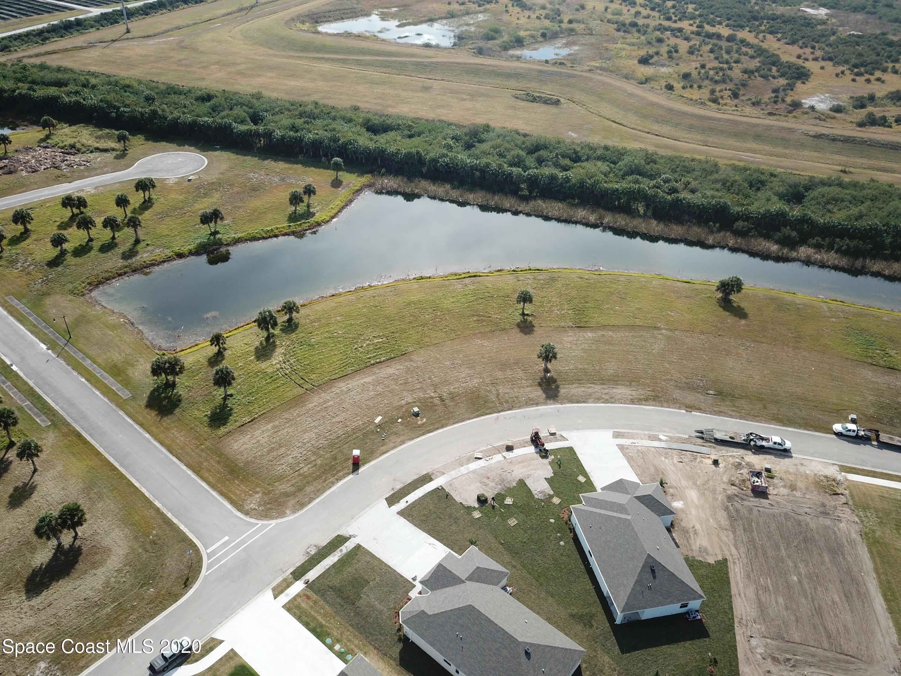 Tbd Micco Road Micco, FL 32976 - Photo 9 of 15 an aerial view of a house with a lake
