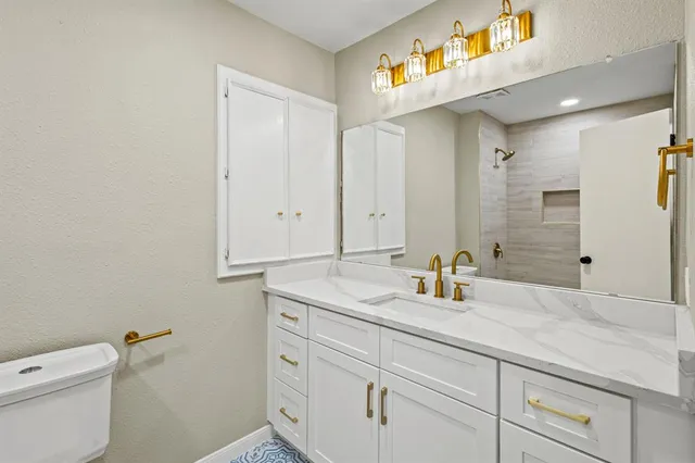 a bathroom with a sink and a toilet