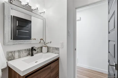 a bathroom with a sink and a mirror