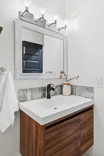 a bathroom with a sink and a mirror