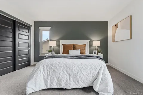 a bedroom with a bed and closet
