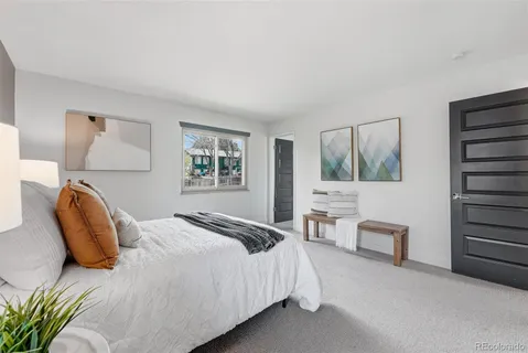 a bedroom with furniture and a window