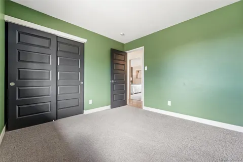 a view of an empty room and fire place