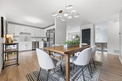a view of a dining room with furniture and wooden floor