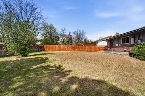 a view of swimming pool of the house along with trees