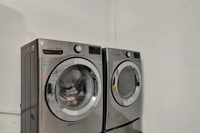 a utility room with dryer and washer