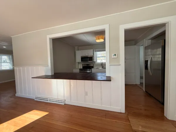 a view of a kitchen from the hallway