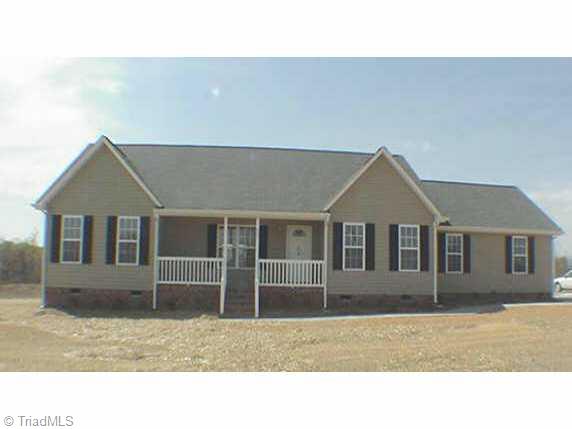 8031 Pritchett Road Browns Summit, NC 27214 - Photo 1 of 9 Exterior Front.