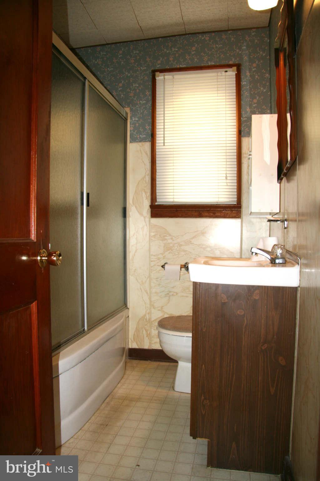 361 Nottingham Road Hagerstown, MD 21740 - Photo 11 of 16 a bathroom with a sink a toilet and shower
