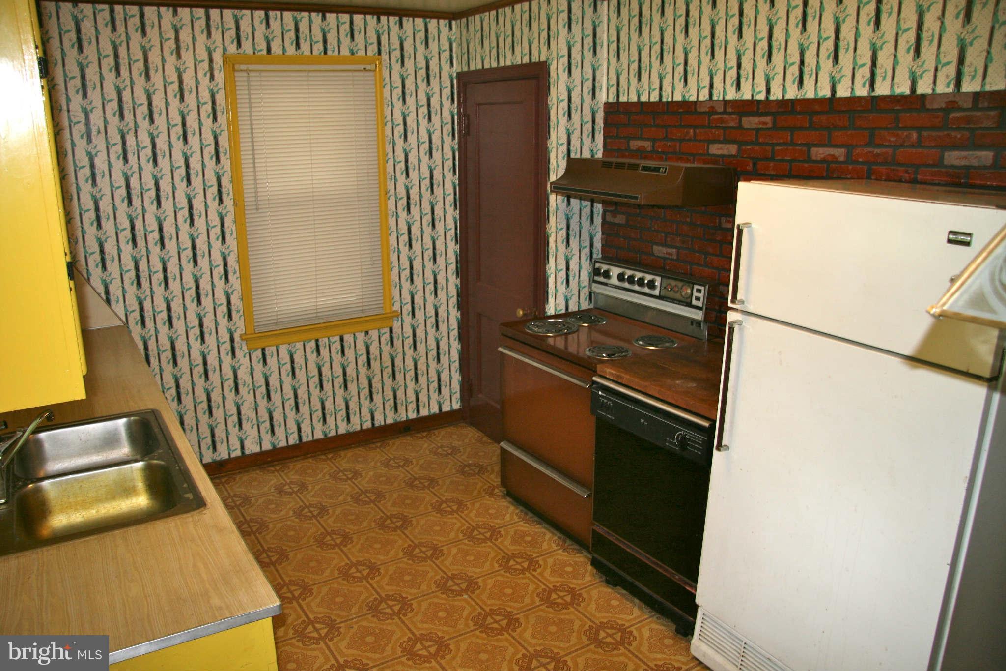 361 Nottingham Road Hagerstown, MD 21740 - Photo 16 of 16 a kitchen with a sink and a refrigerator