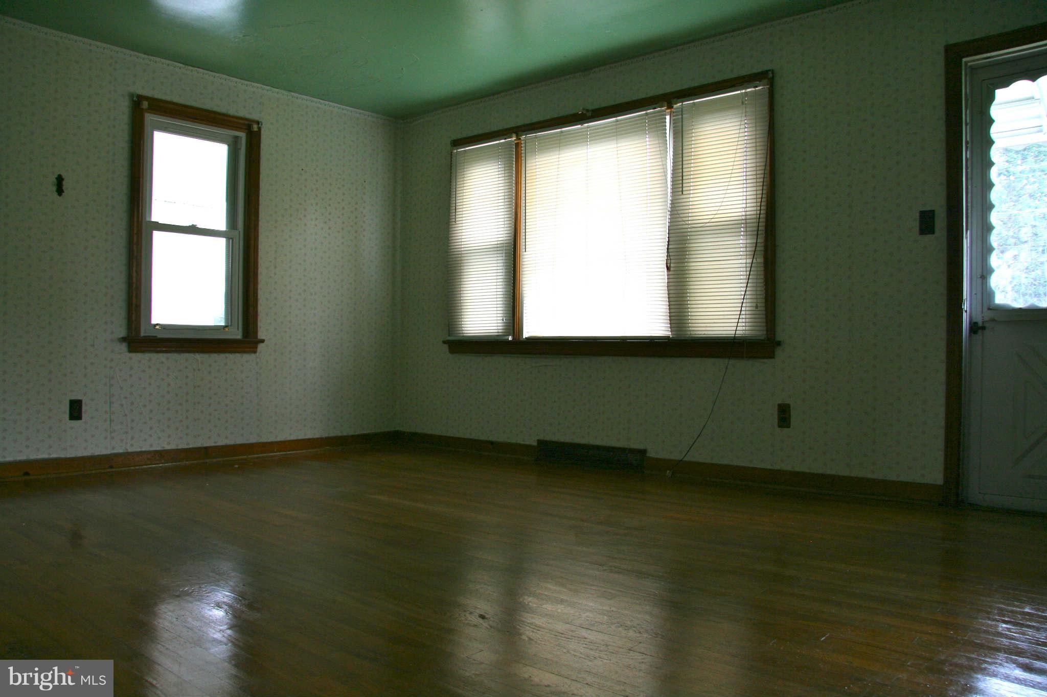 361 Nottingham Road Hagerstown, MD 21740 - Photo 8 of 16 a view of an empty room with wooden floor and a window