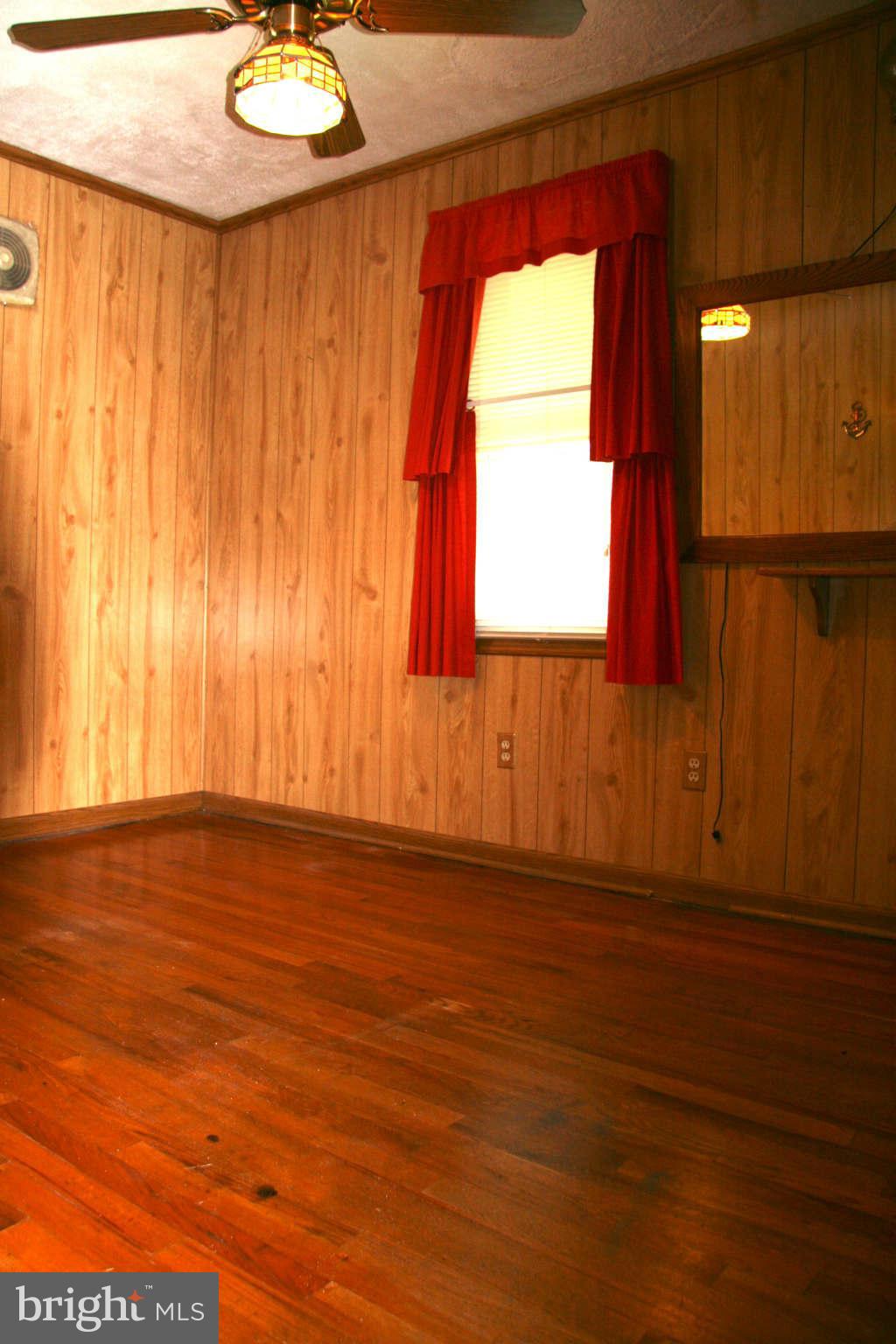 361 Nottingham Road Hagerstown, MD 21740 - Photo 10 of 16 a view of a livingroom with wooden floor and a window