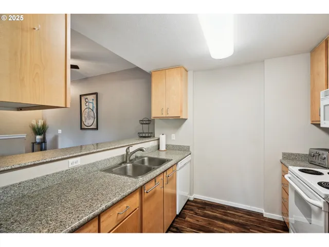 a kitchen that has a sink and a stove