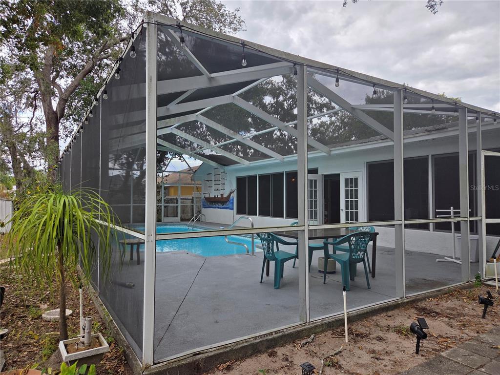 7605 Landmark Drive Spring Hill, FL 34606 - Photo 25 of 26 a view of a chairs and table in the patio