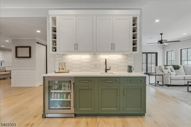 a living room with furniture a fireplace and a table