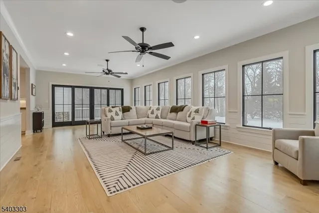 a bathroom with a granite countertop sink a toilet a mirror and shower