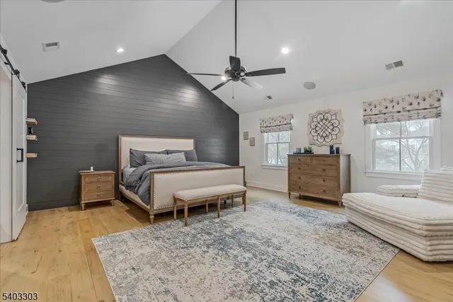 a bathroom with a sink a shower and a mirror