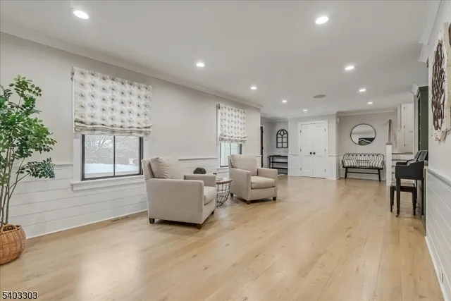 a kitchen with stainless steel appliances a sink a stove top oven a counter space and cabinets