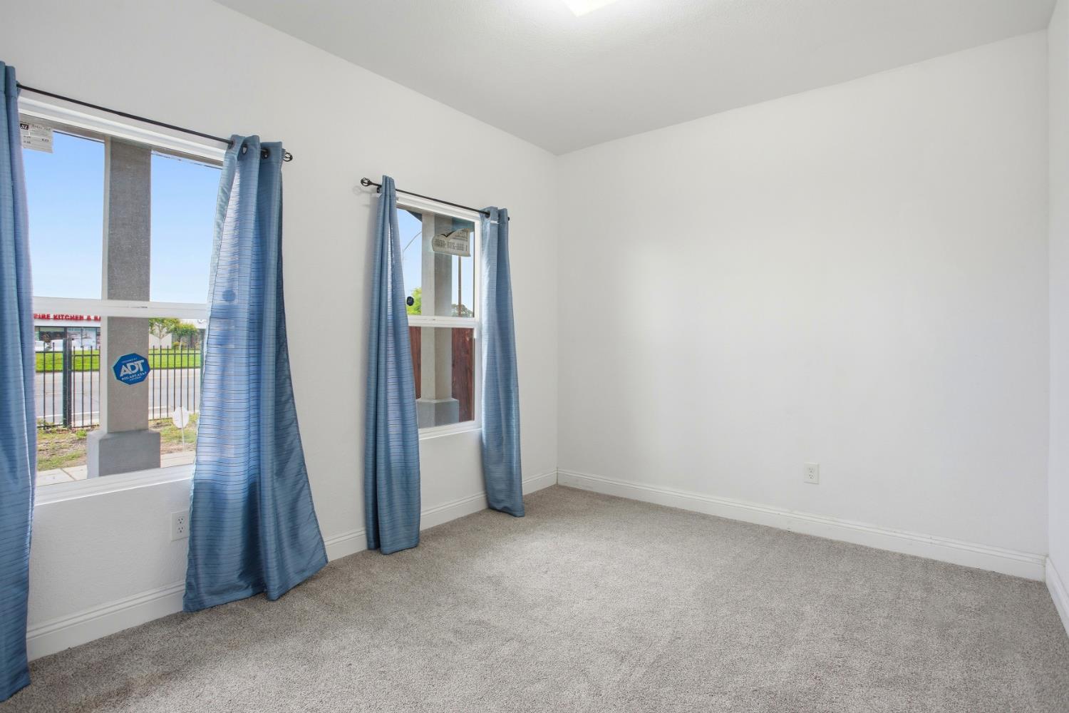 5680 Power Inn Road Sacramento, CA 95824 - Photo 12 of 48 an empty room with windows and closet