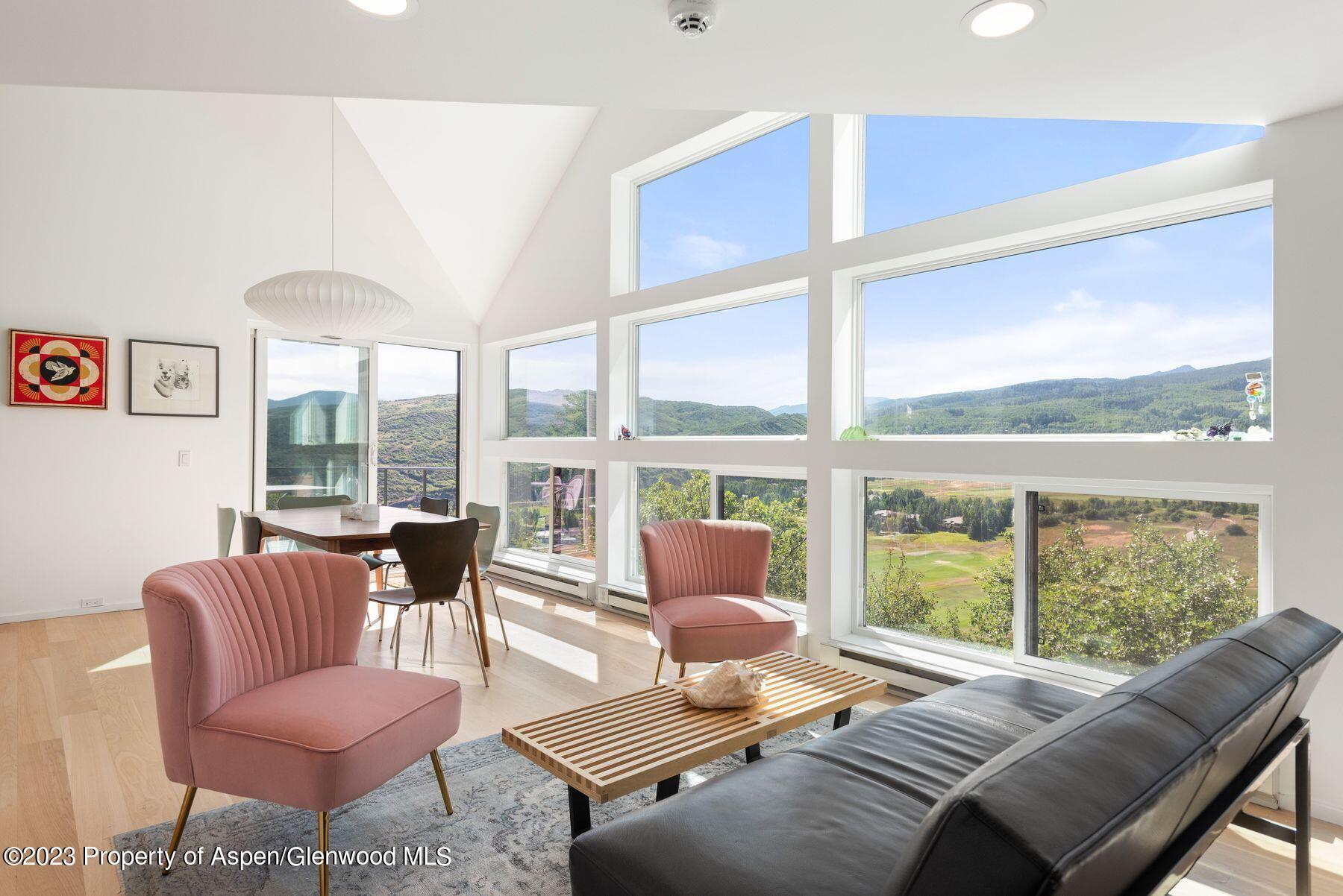 61 Oak Ridge Road Snowmass Village, CO 81615 - Photo 18 of 48 a living room with furniture and a large window