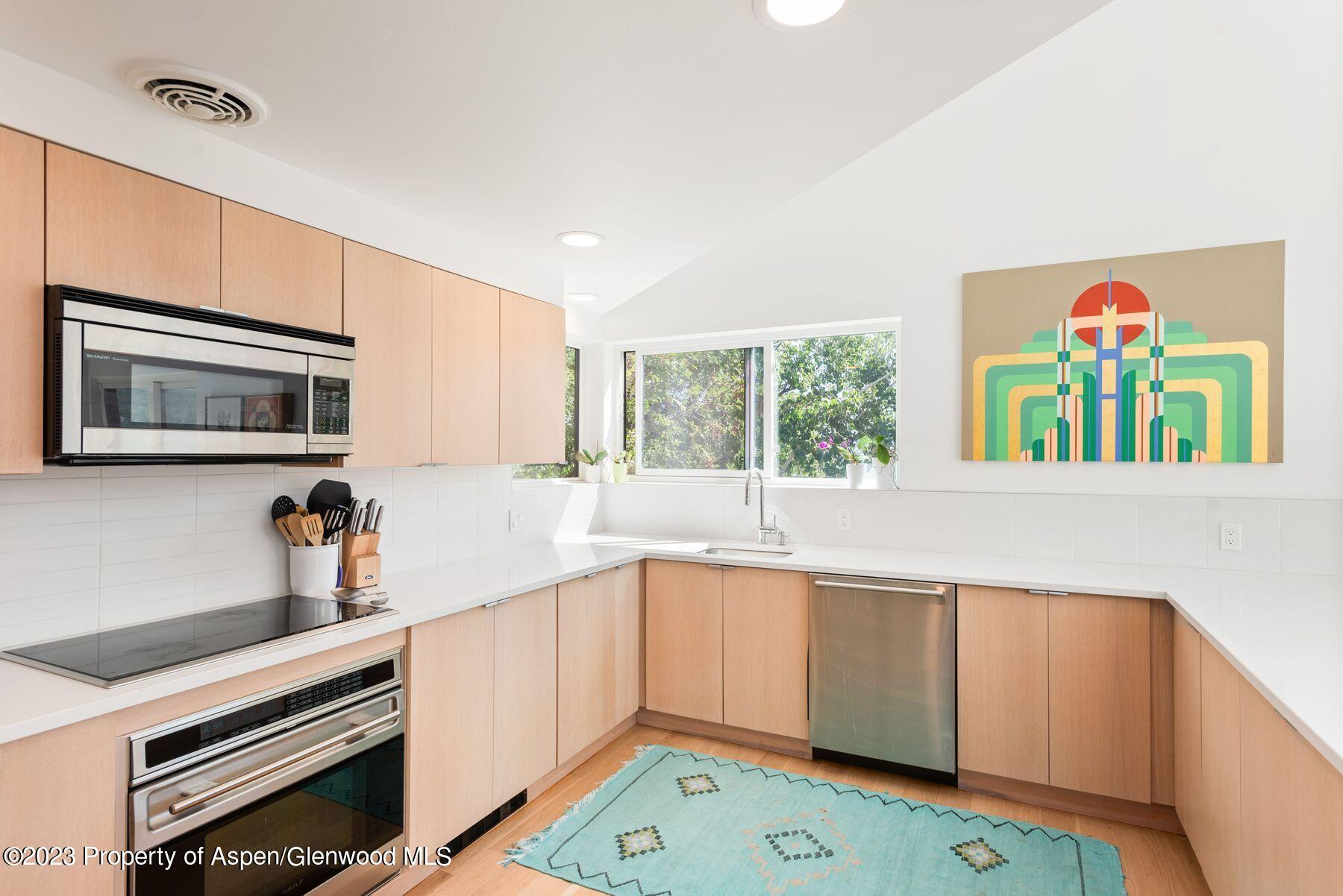 61 Oak Ridge Road Snowmass Village, CO 81615 - Photo 19 of 48 a kitchen with a sink cabinets and window