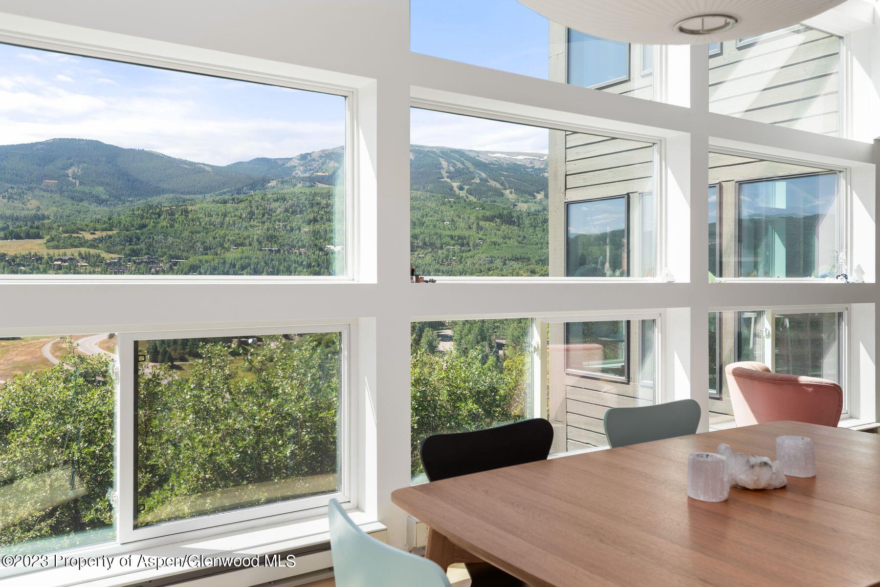 61 Oak Ridge Road Snowmass Village, CO 81615 - Photo 22 of 48 a view of a dining room with furniture window and outside view