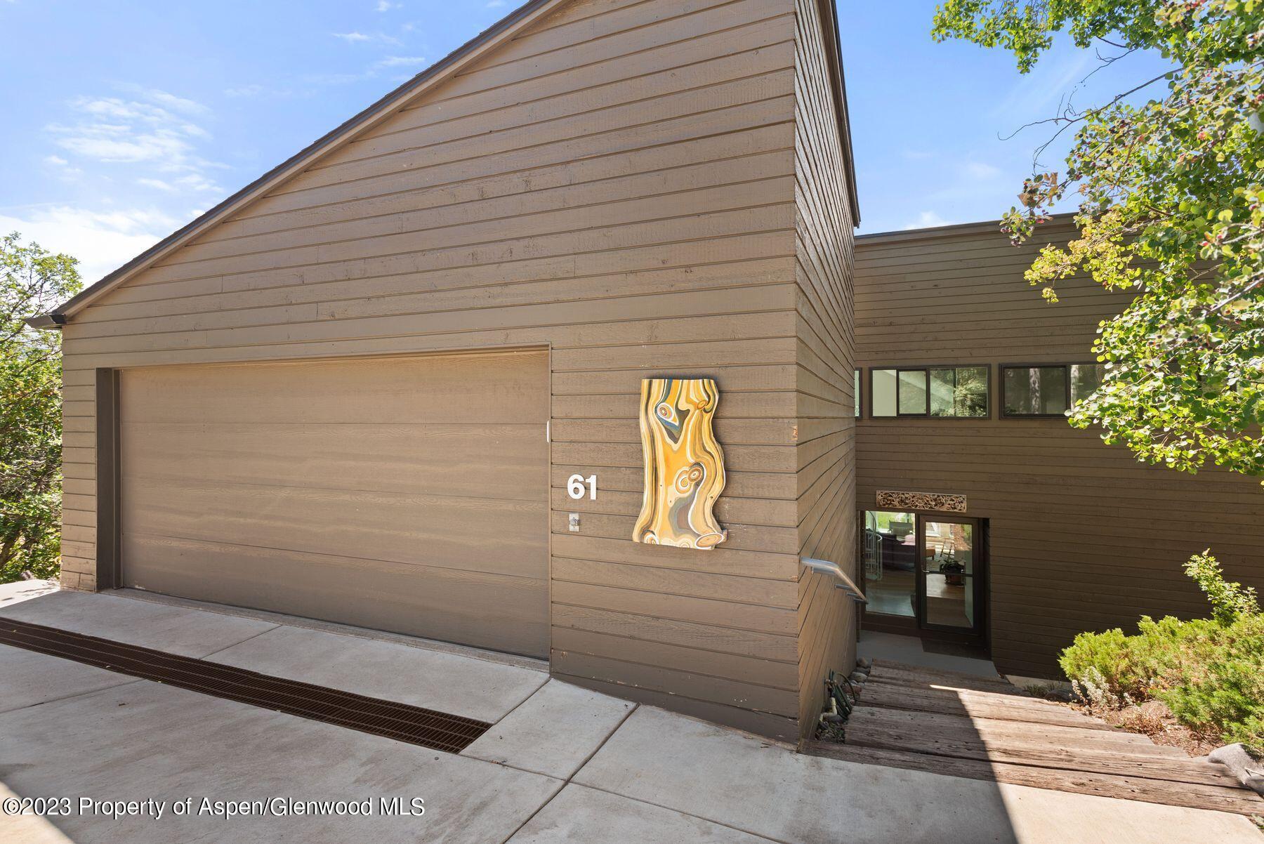 61 Oak Ridge Road Snowmass Village, CO 81615 - Photo 25 of 48 a view of a wooden door and chair