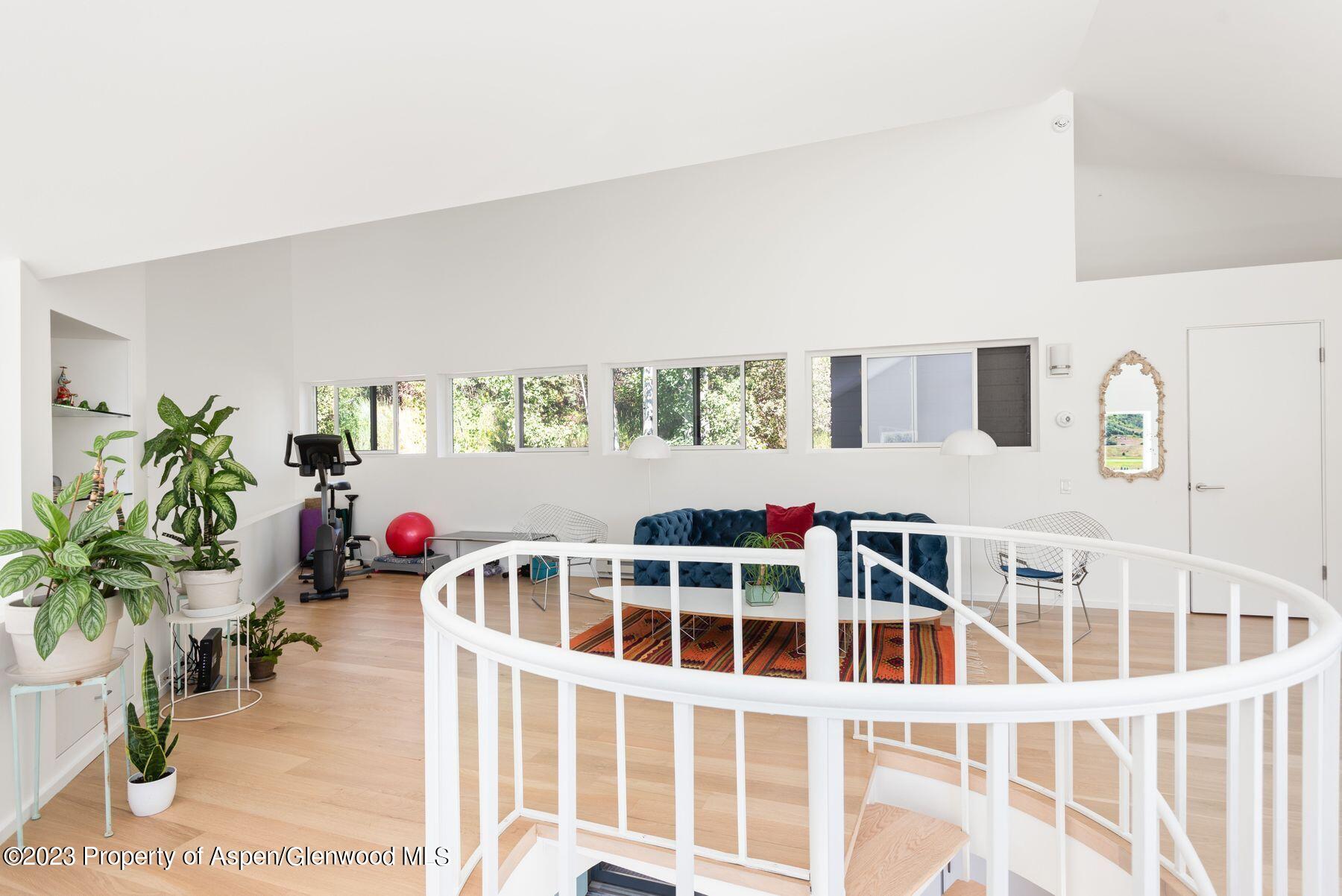 61 Oak Ridge Road Snowmass Village, CO 81615 - Photo 26 of 48 a front view of a house with a yard