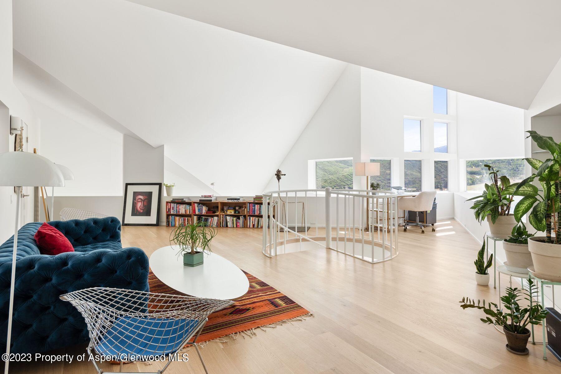 61 Oak Ridge Road Snowmass Village, CO 81615 - Photo 27 of 48 a living room with furniture and a floor to ceiling window