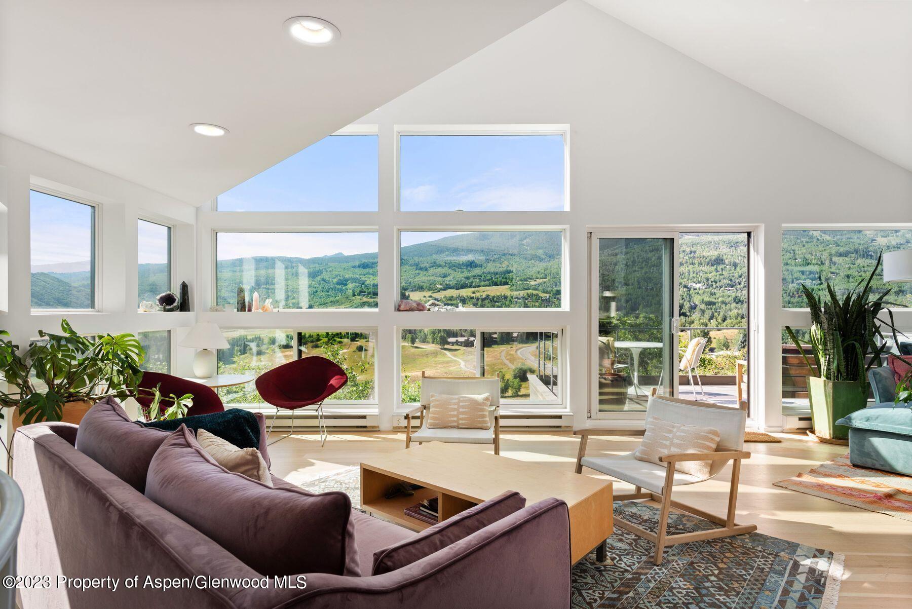 61 Oak Ridge Road Snowmass Village, CO 81615 - Photo 3 of 48 a living room with furniture and a large window