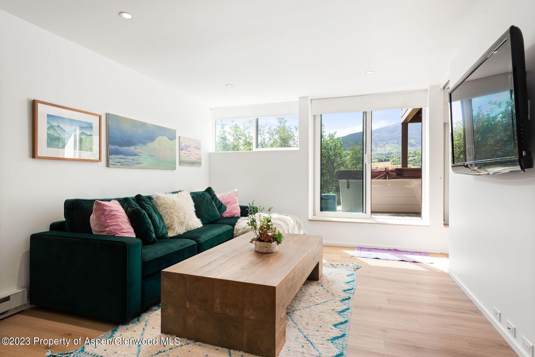 61 Oak Ridge Road Snowmass Village, CO 81615 - Photo 32 of 48 a living room with furniture and a flat screen tv