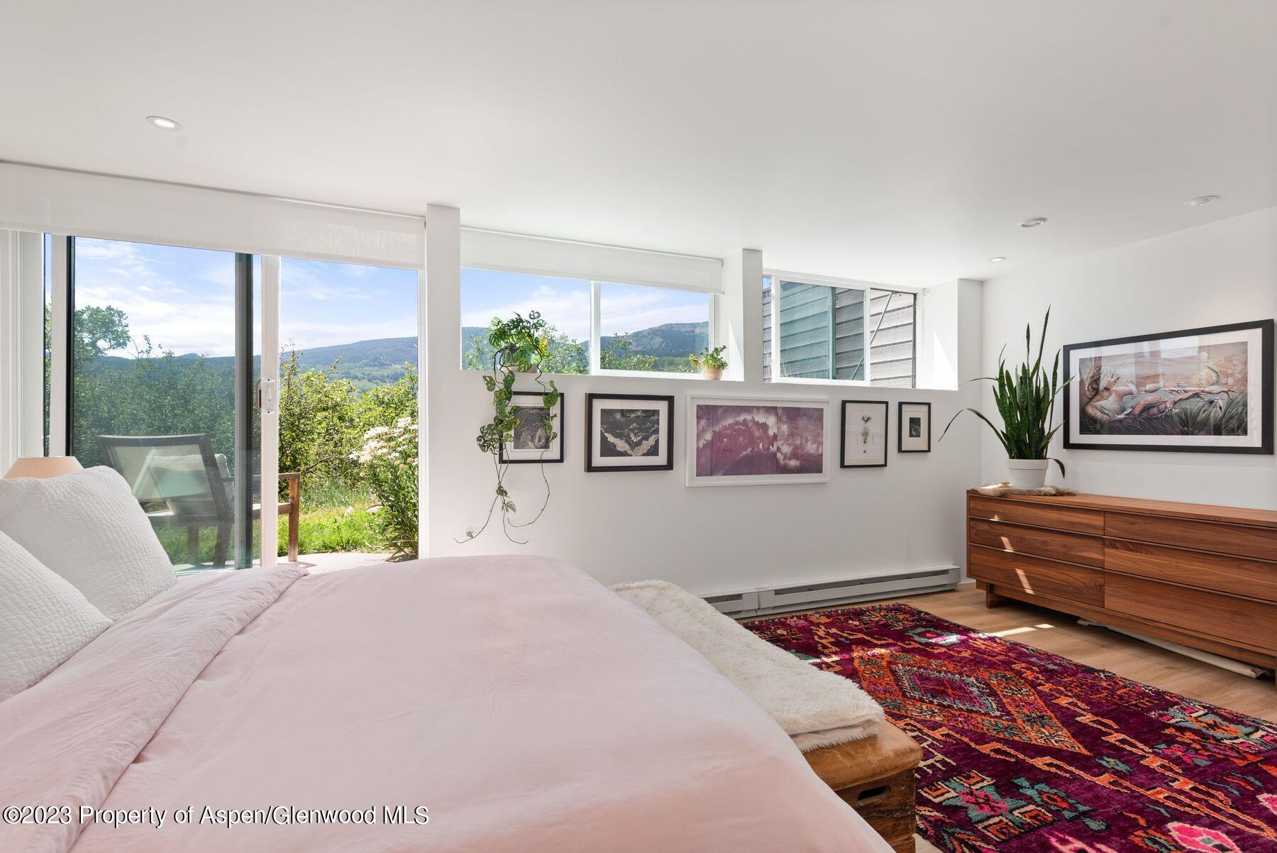 61 Oak Ridge Road Snowmass Village, CO 81615 - Photo 34 of 48 a bed sitting in a bedroom next to a window