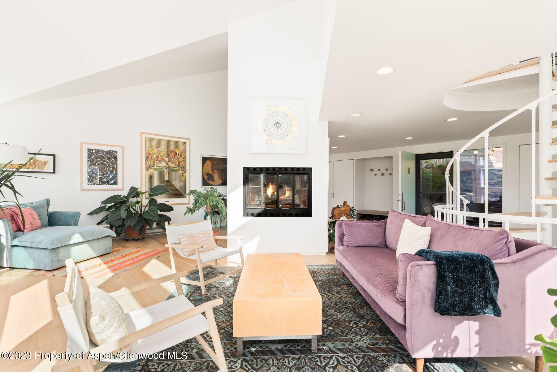 61 Oak Ridge Road Snowmass Village, CO 81615 - Photo 4 of 48 a living room with fireplace furniture and a flat screen tv