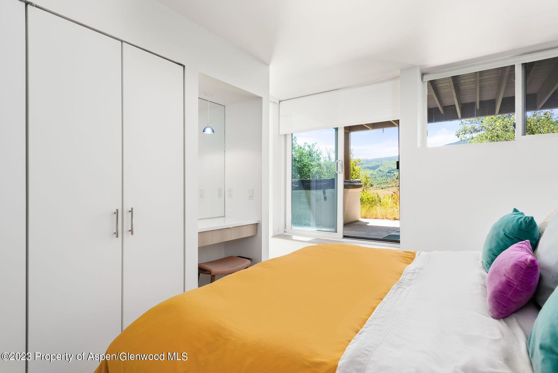 61 Oak Ridge Road Snowmass Village, CO 81615 - Photo 41 of 48 a bedroom with a bed and a window