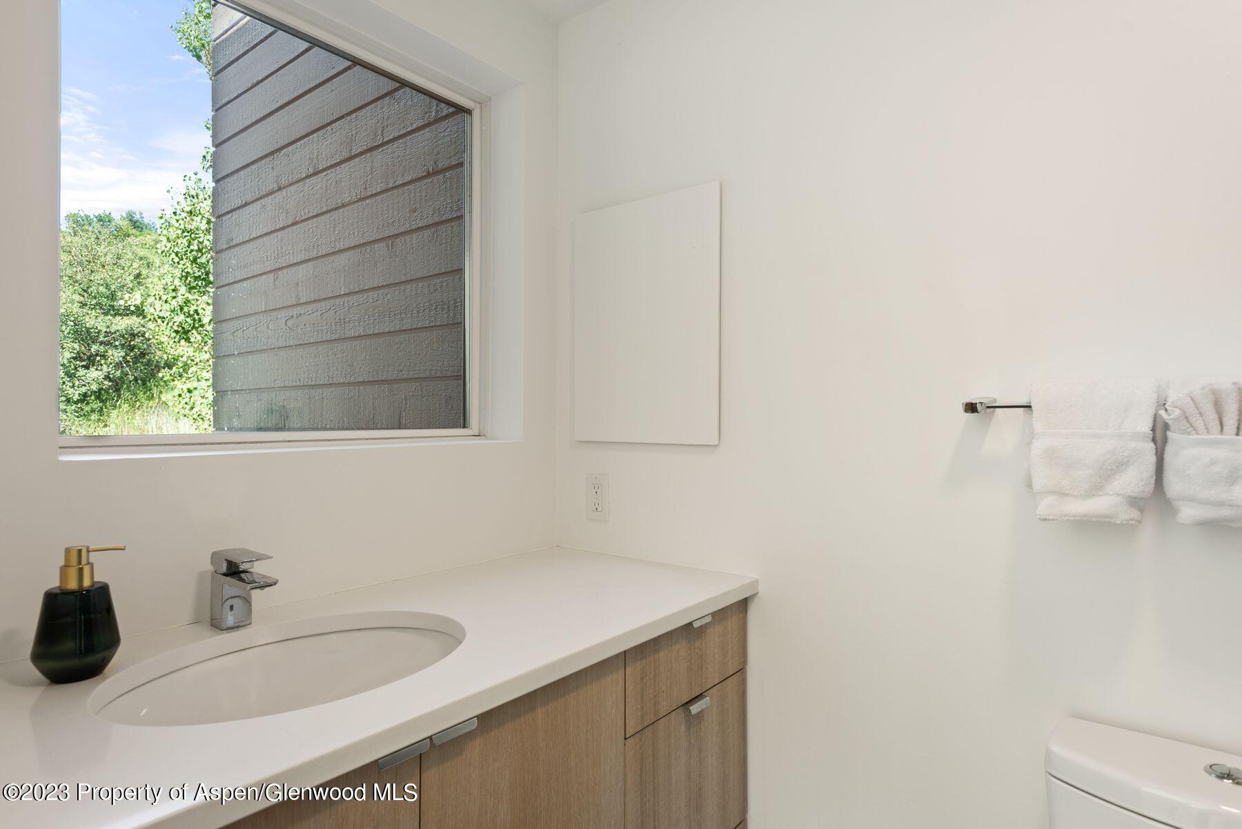 61 Oak Ridge Road Snowmass Village, CO 81615 - Photo 42 of 48 a bathroom with a sink and a mirror