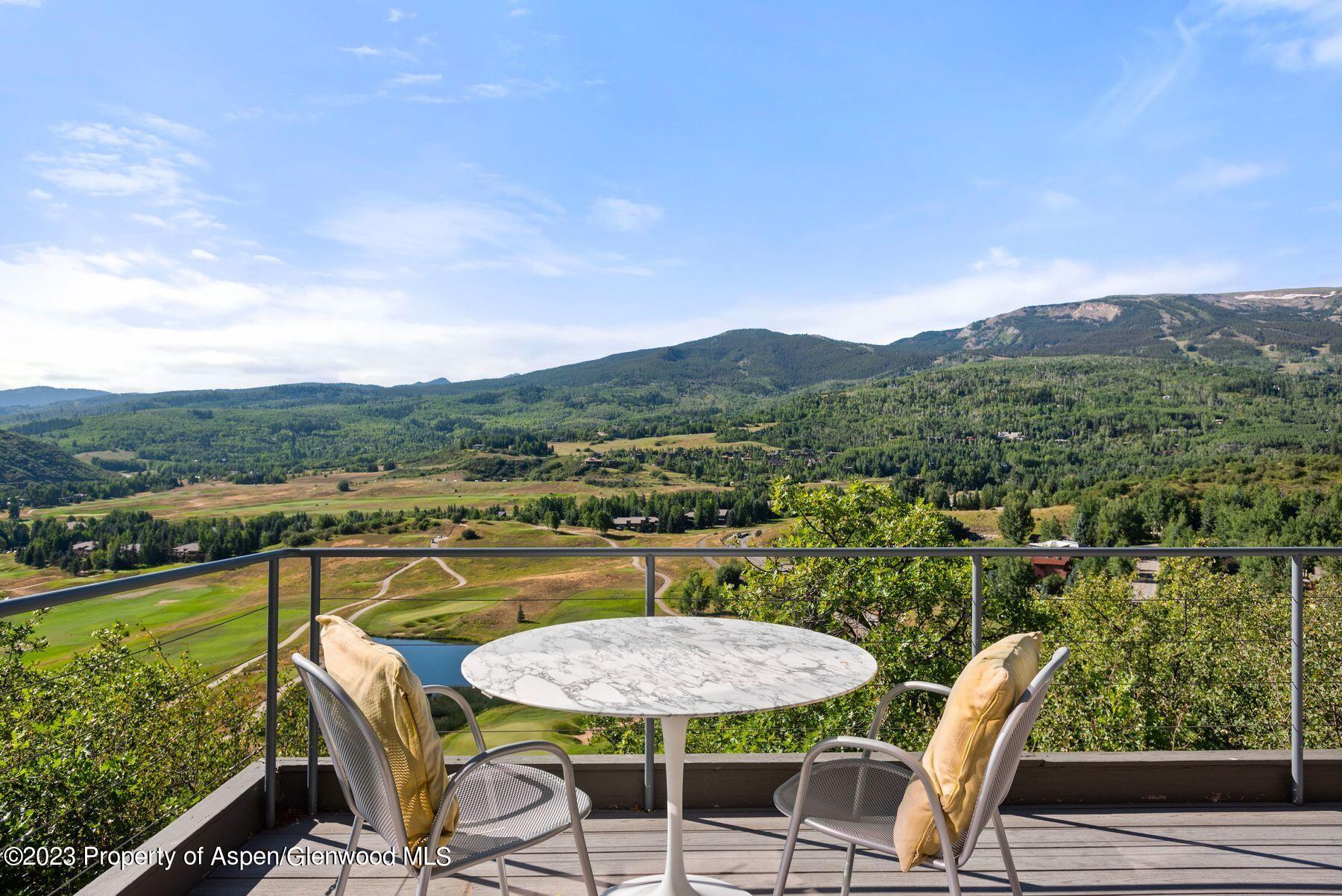 61 Oak Ridge Road Snowmass Village, CO 81615 - Photo 6 of 48 a view of a chairs and table in patio