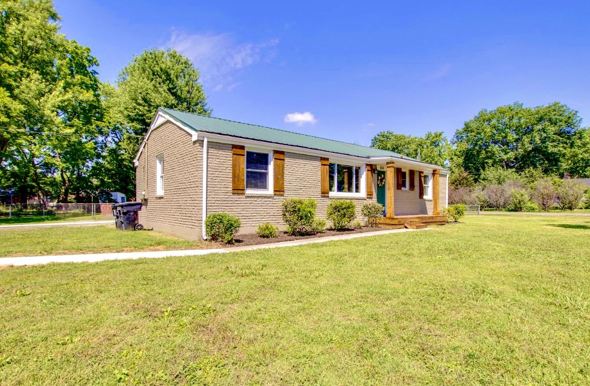 604 Cardinal Drive Murfreesboro, TN 37130 - Photo 2 of 16 a view of a house with swimming pool and a yard