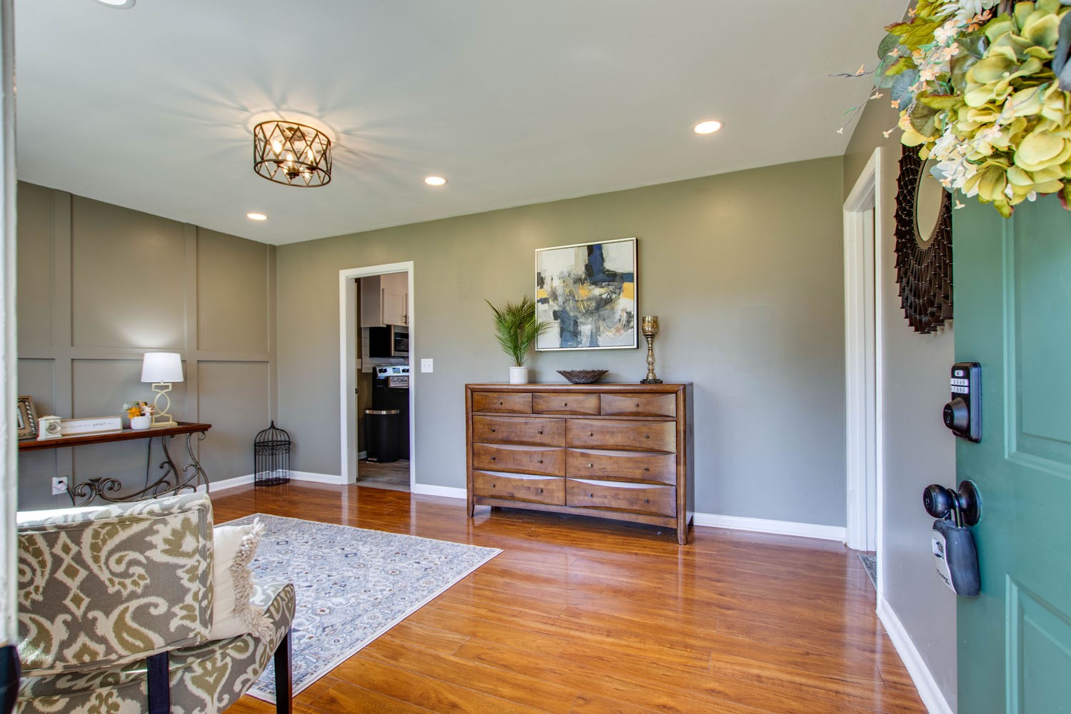 604 Cardinal Drive Murfreesboro, TN 37130 - Photo 5 of 16 a view of a hallway with wooden floor and chandelier