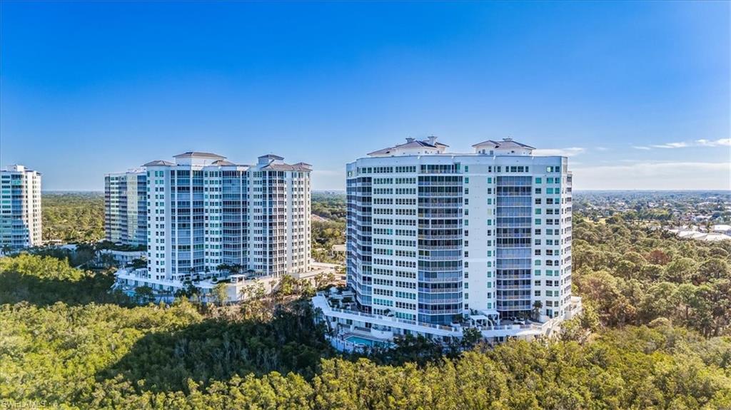 295 Grande Way, Unit 702 Naples, FL 34110 - Photo 31 of 31 a view of a city with tall buildings