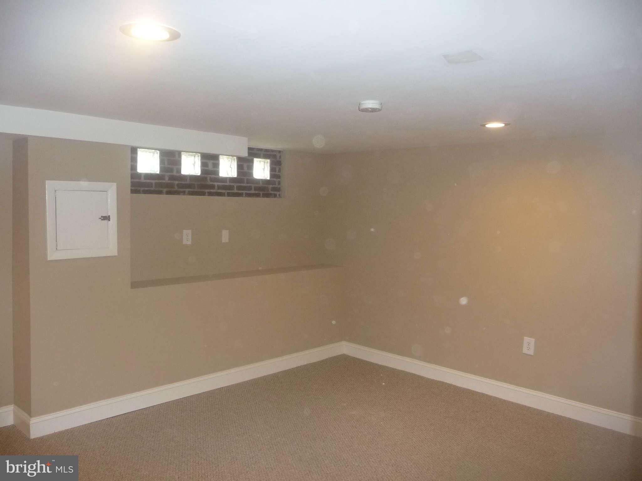 1018 Witherspoon Road Baltimore, MD 21212 - Photo 14 of 19 a view of an empty room with a window