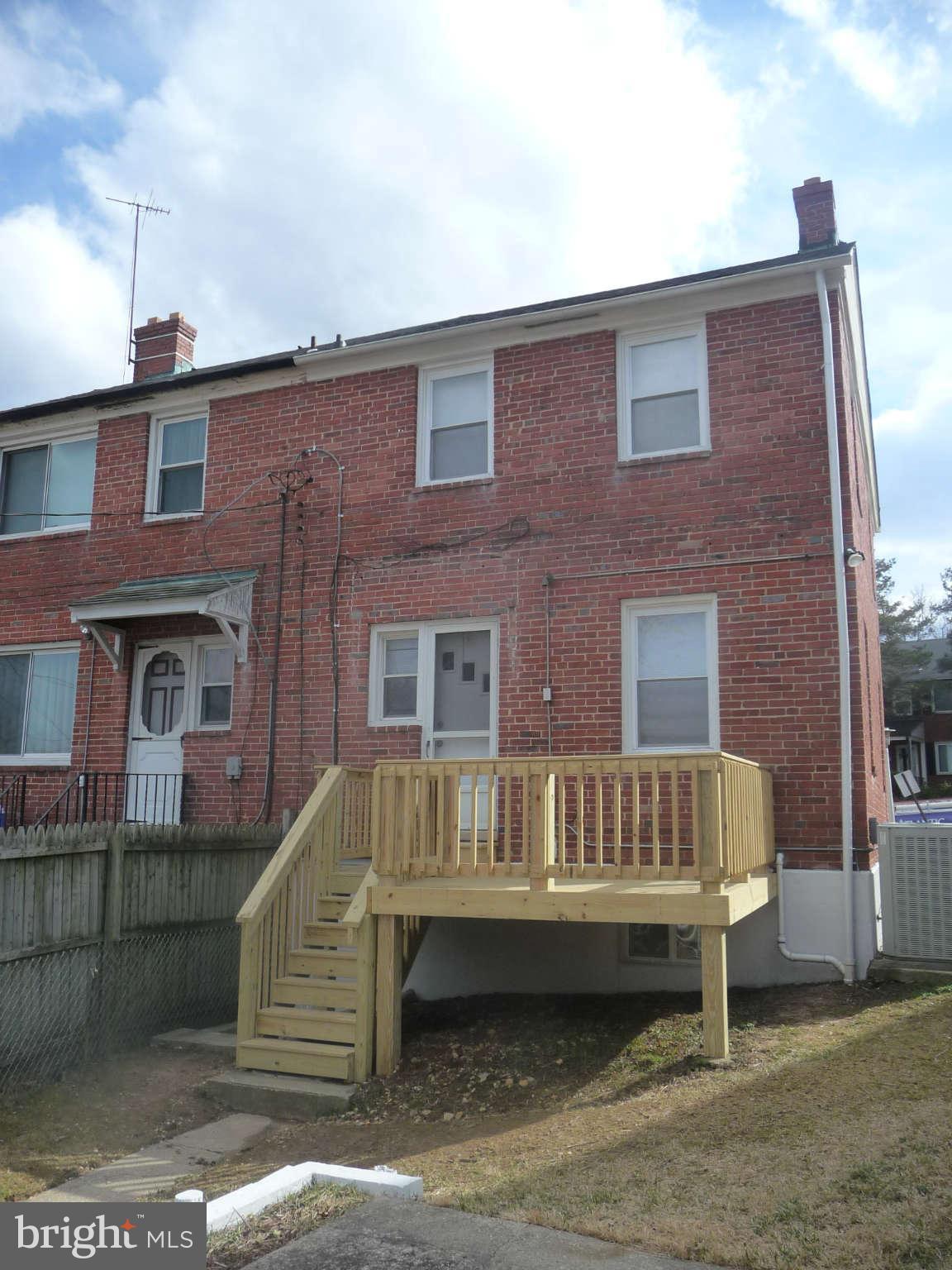 1018 Witherspoon Road Baltimore, MD 21212 - Photo 17 of 19 a view of a brick house with many windows