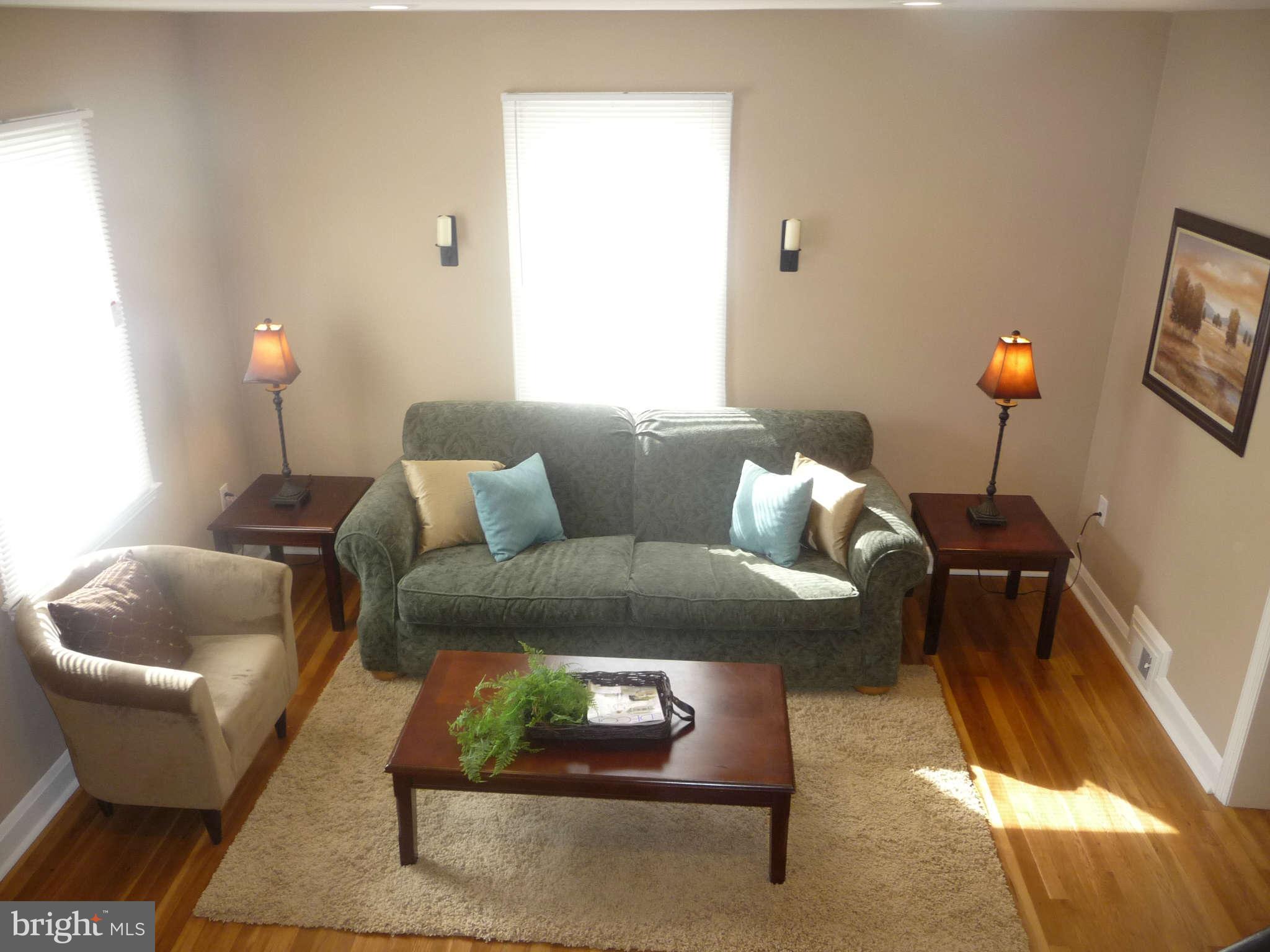 1018 Witherspoon Road Baltimore, MD 21212 - Photo 3 of 19 a living room with furniture and a window