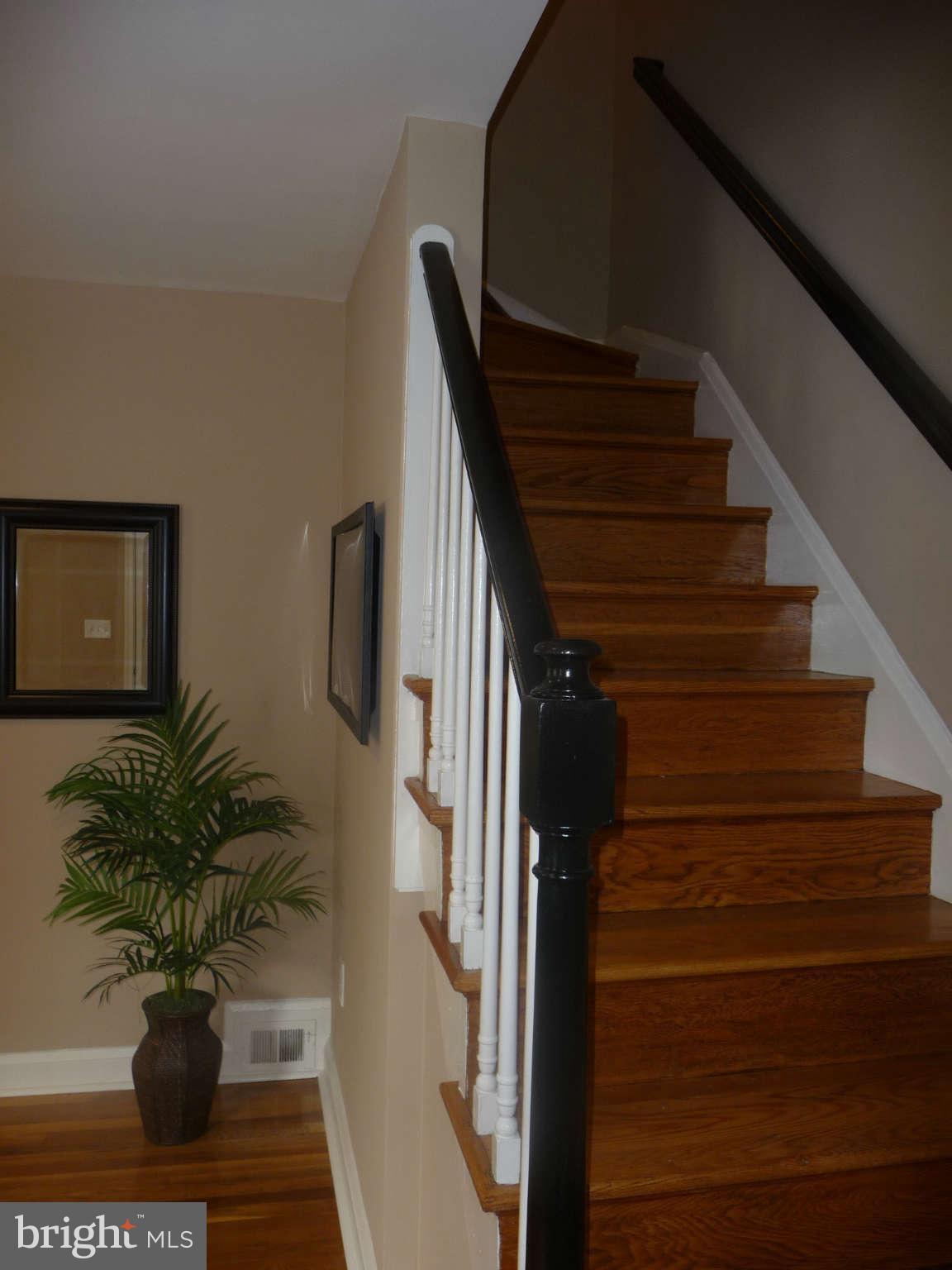 1018 Witherspoon Road Baltimore, MD 21212 - Photo 8 of 19 a view of entryway and hall with wooden floor