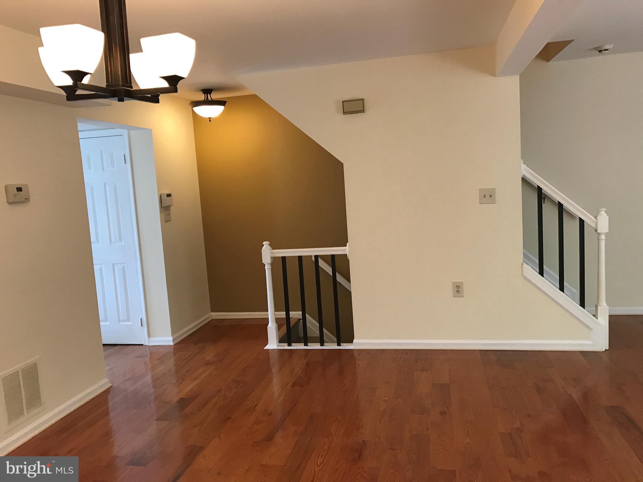 10504 Grove Ridge Place, Unit 48 Rockville, MD 20852 - Photo 11 of 30 wooden floor in an empty room