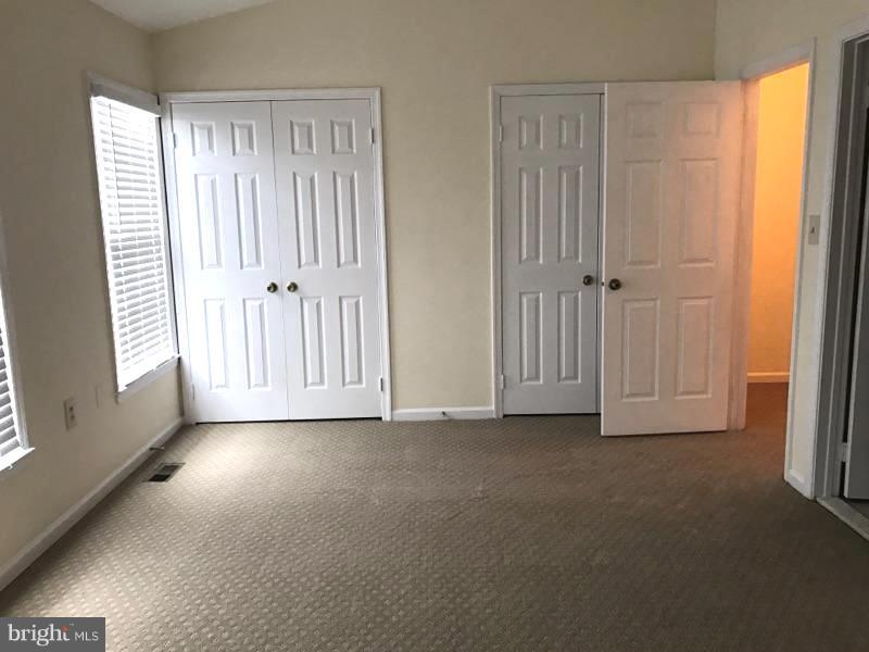 10504 Grove Ridge Place, Unit 48 Rockville, MD 20852 - Photo 16 of 30 a view of a livingroom with an empty space and a window