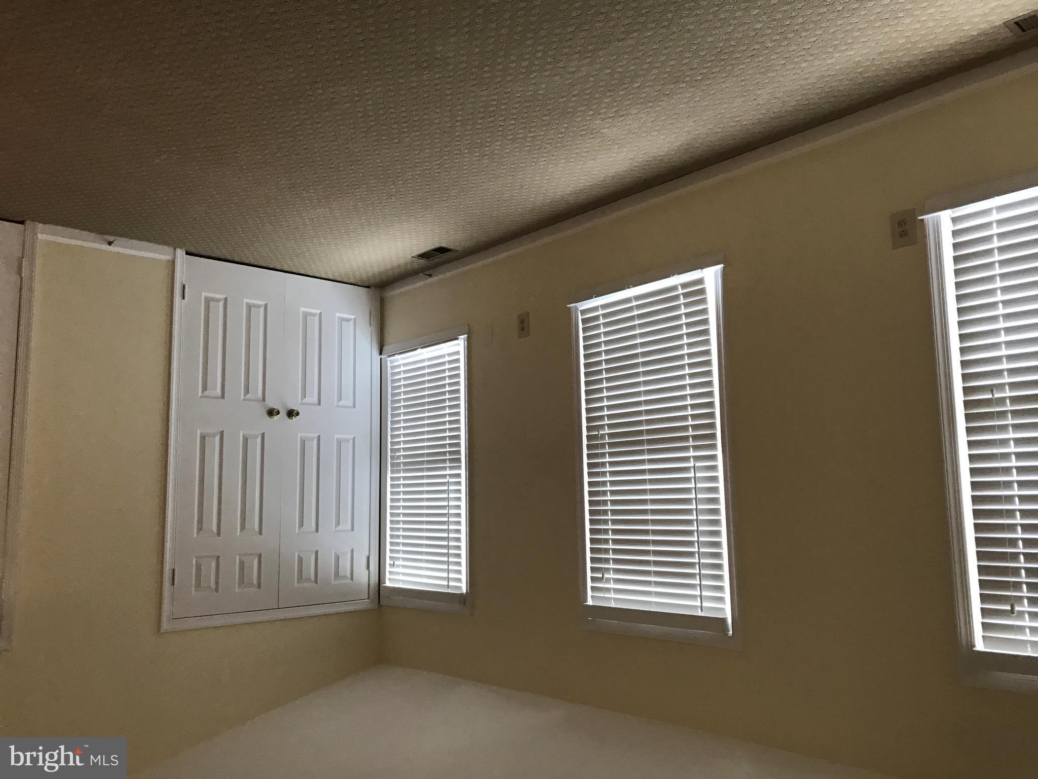 10504 Grove Ridge Place, Unit 48 Rockville, MD 20852 - Photo 17 of 30 a view of an empty room with a window