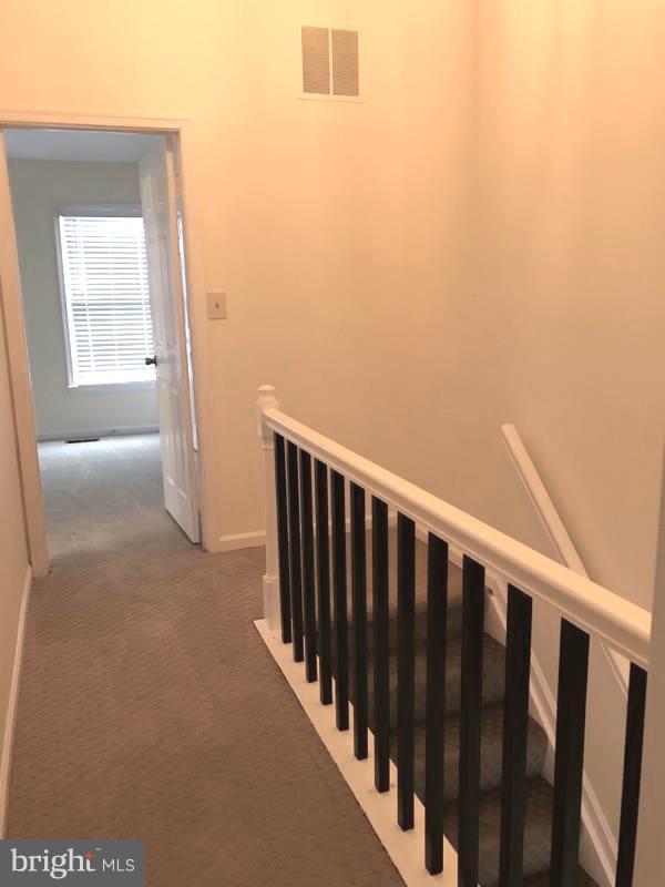 10504 Grove Ridge Place, Unit 48 Rockville, MD 20852 - Photo 19 of 30 a view of hallway with wooden floor